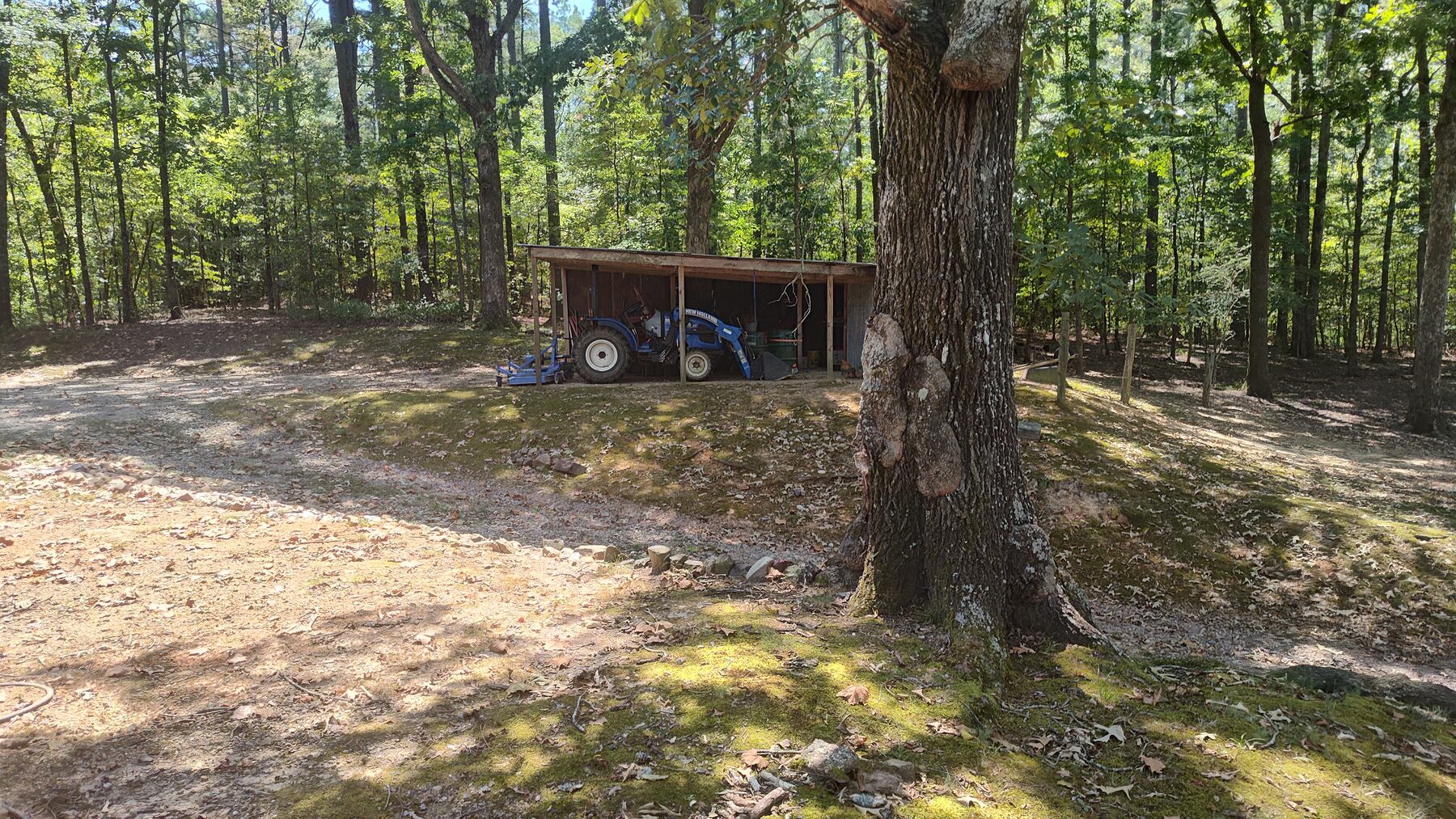 Covered tractor shed